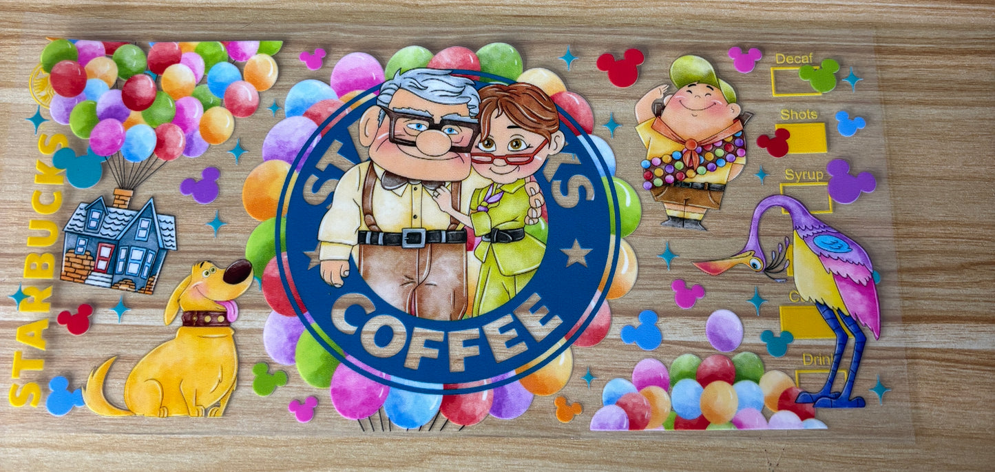 The image is a colorful and whimsical Starbucks coffee mug featuring various cartoon characters and elements, such as a man and a woman embracing, a dog, and a bird.