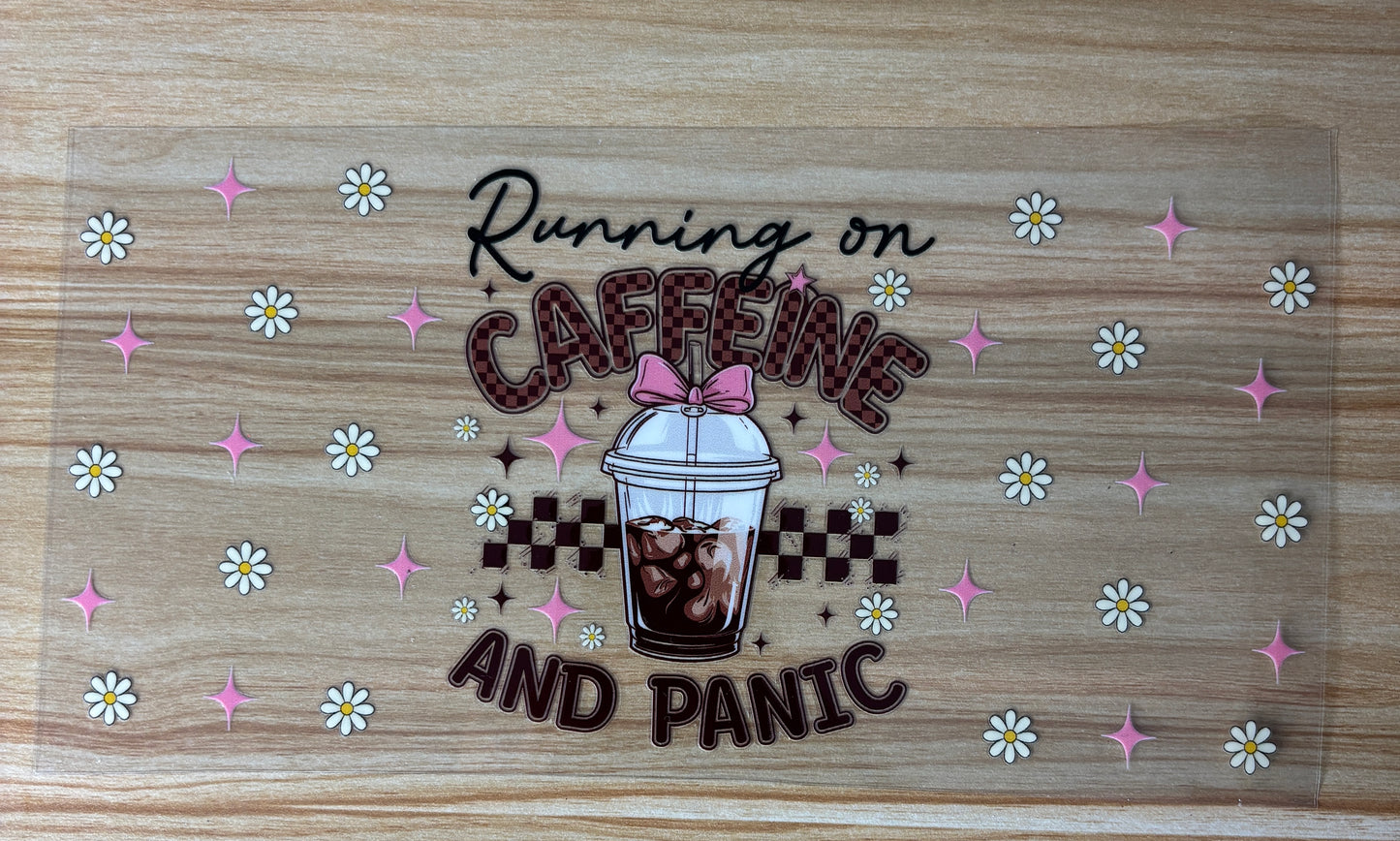 a clear cup with a straw, surrounded by pink and white flowers, and the text "Running on Caffeine and Panic" written above it.