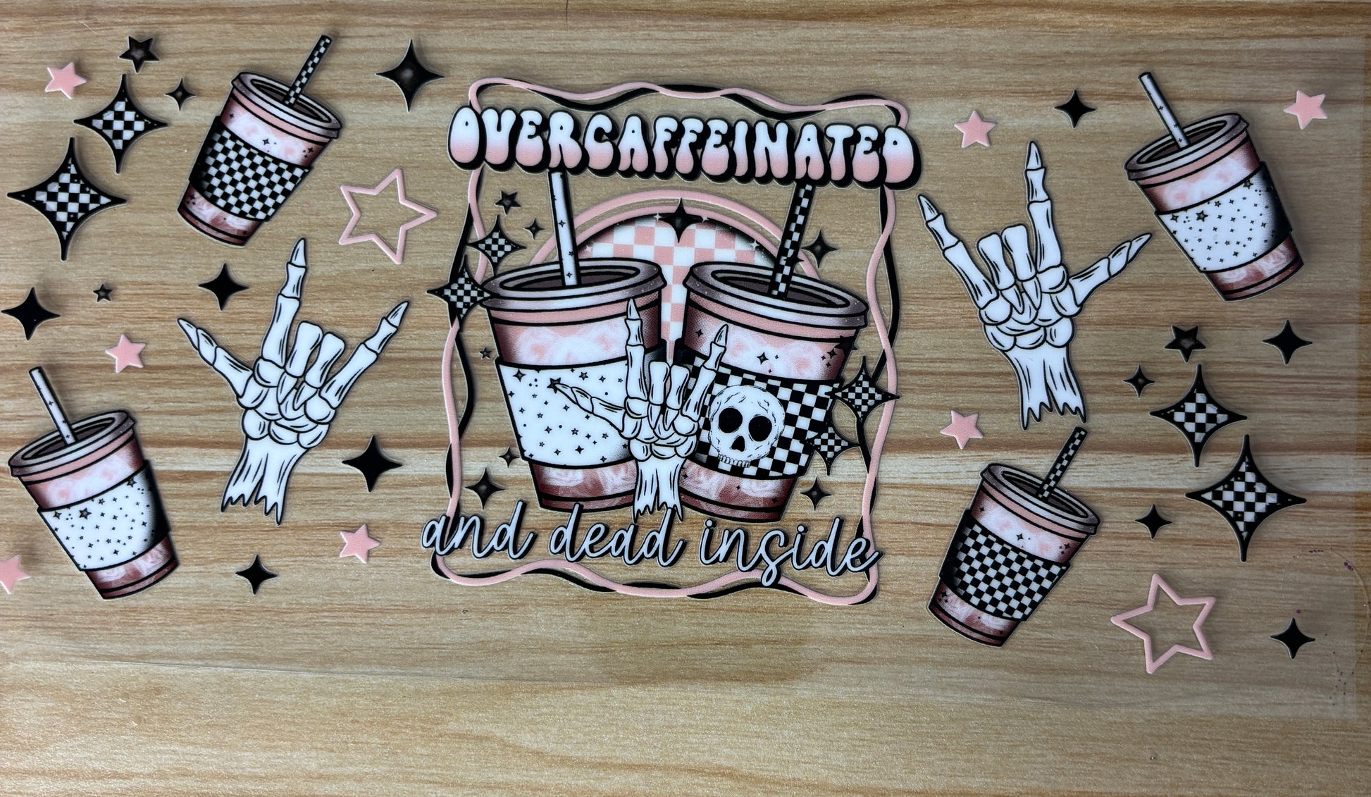 The image is a collage featuring various cartoon-style illustrations of skeletal hands and cups with the text "Overcaffeinated and dead inside".