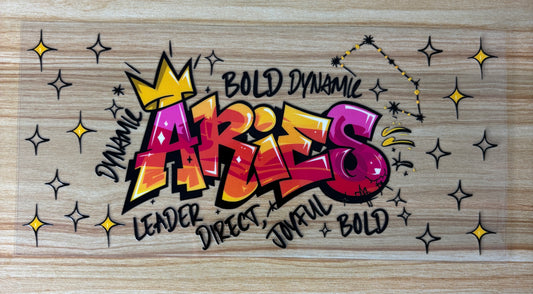 a vibrant graffiti-style text that reads "ARIES" with various colorful elements surrounding it, such as stars and a crown.